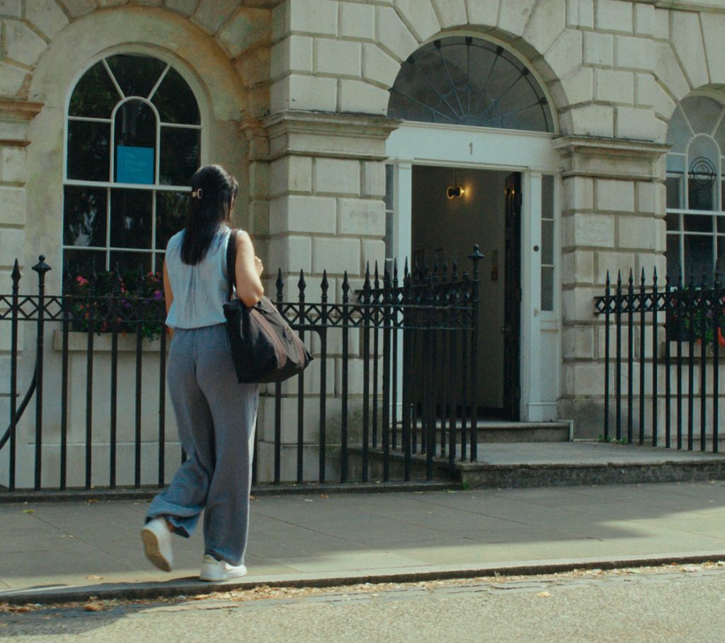 woman walking towards the clinic